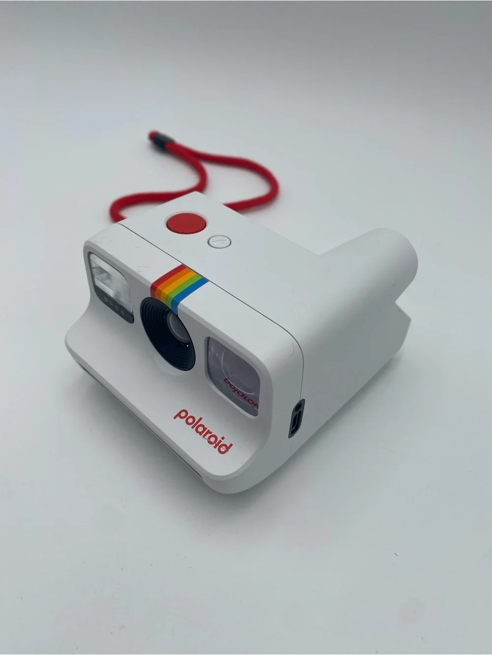 Polaroid White Instant Camera with Red Accent and Rainbow Stripe